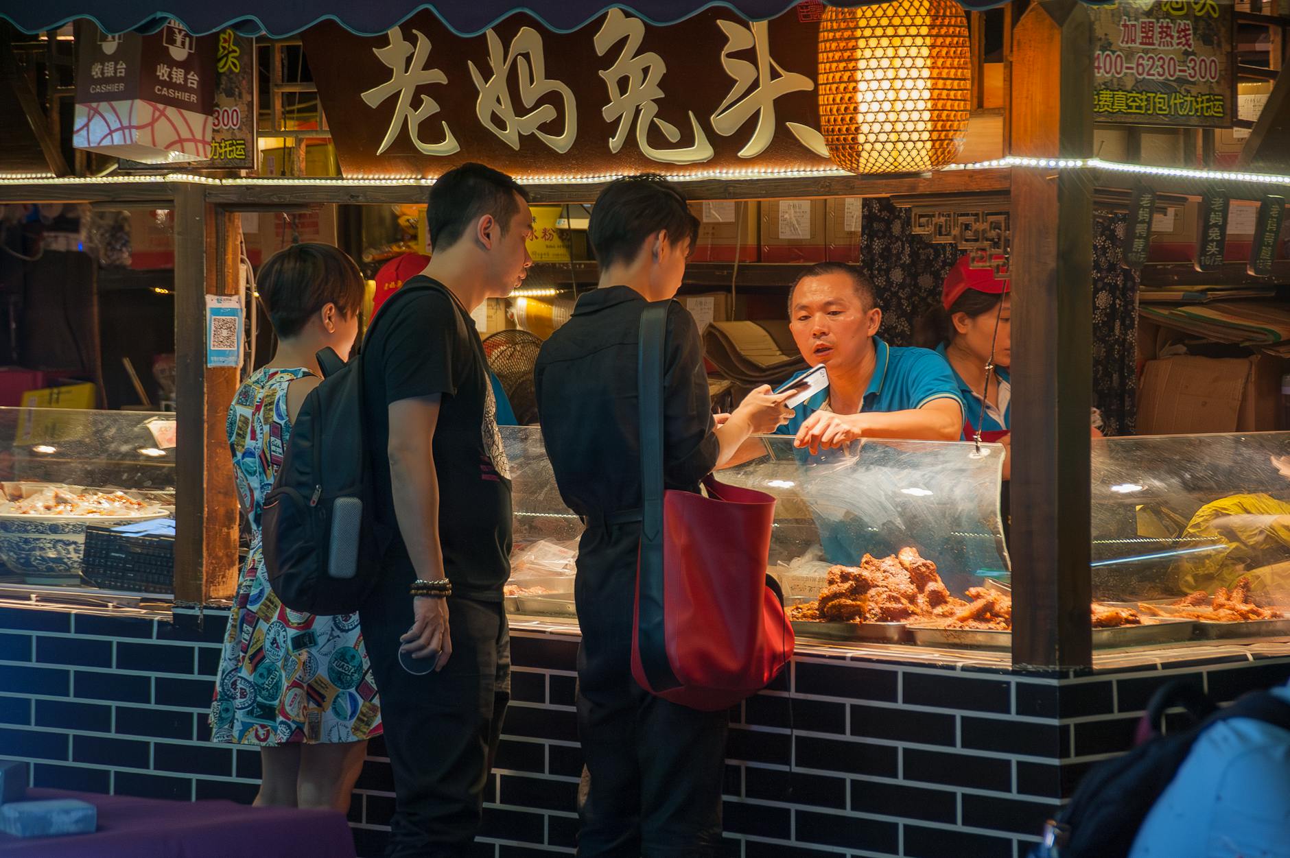 busy night market food stall in asia